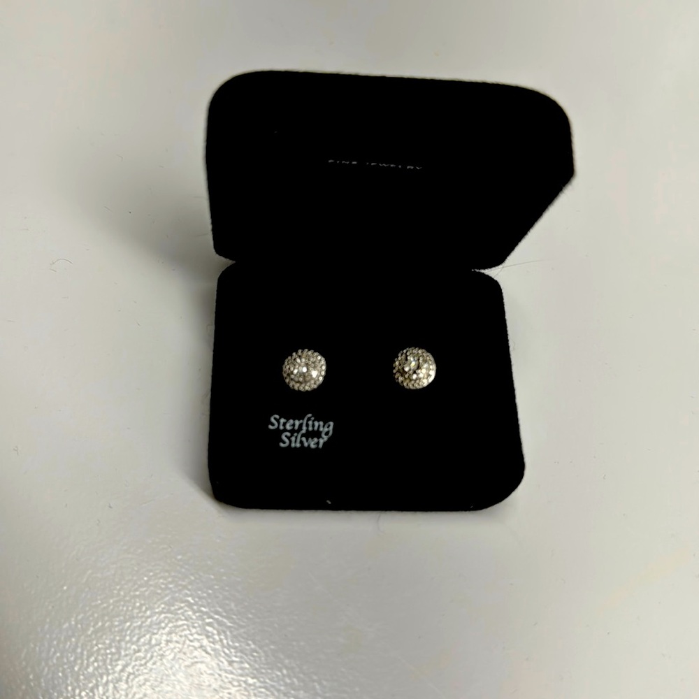 Sterling silver earrings with a small diamond 1/10 CTTW